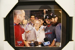 Johnny Pesky holds world series trophy