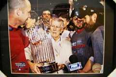 Johnny Pesky holds world series trophy